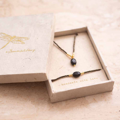 Geschenkset Confidence Schwarzer Onyx Vergoldet